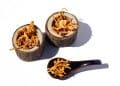 Cordyceps candida health benefits, in a spoon on a table